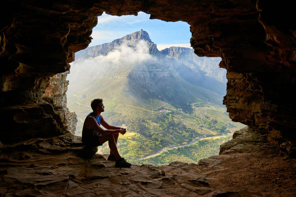 men sitting on mountain with happy thought
