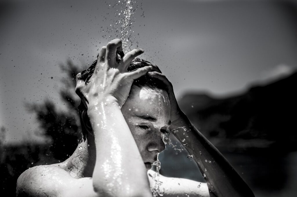 Boy taking cold shower during winter. image source-pixabay